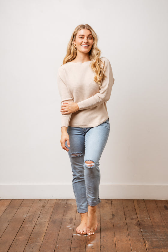 The Abbie Knit Jumper is the perfect fashion knit, featuring a boat neckline, soft horizontal rib, a slightly batwing sleeve, relaxed body fit & scoop hemline. Available from www.arlowboutique.com
