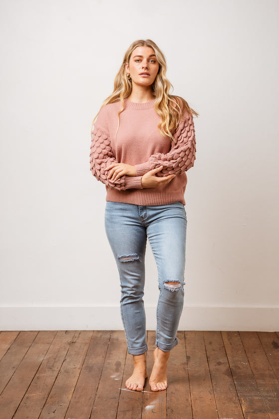 Stay cosy in the Kimbra Knit Jumper! Featuring a crew neck, mid body length in a relaxed fit with detailing on sleeve. An effortless cool piece. Available from arlowboutique.com.au
