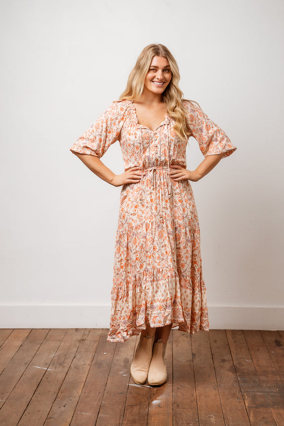 Milarose Midi Dress is a romantic and feminine piece in a vintage inspired floral print in soft rayon. Features include button front detail with elastic waist and tie, short blouse sleeves and a three tiered skirt. Style it with your favourite sandal or boot. Available from arlowboutique.com
