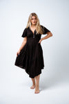 Command the attention of a room in this show stopping piece. The Elora Dress is a stunning flutter sleeve dress with fitted and shaped under bust band and curved hem midi skirt with single tier frill. Available from www.arlowboutique.com