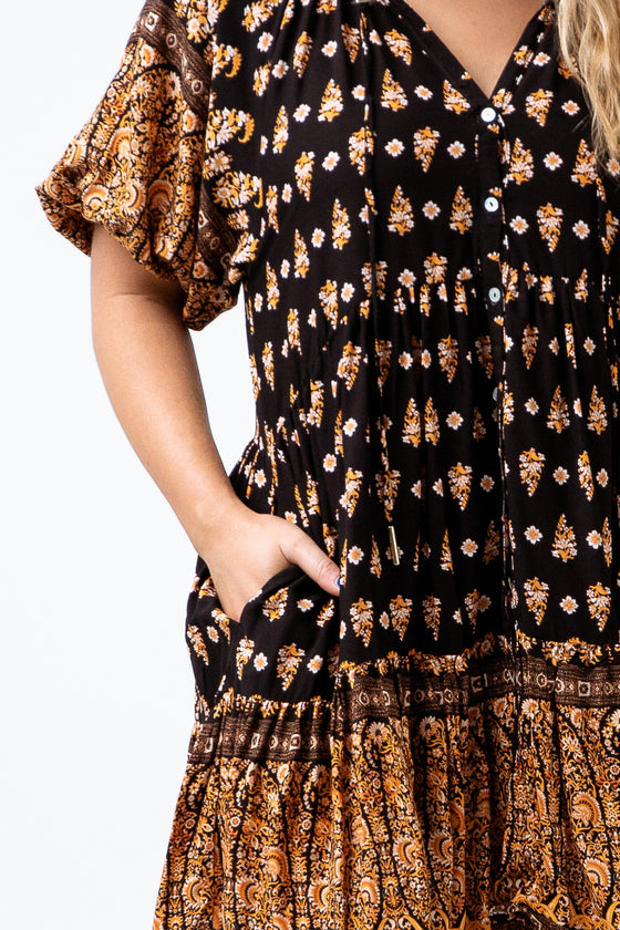 The Nina Print Dress is understated yet striking and available in a Black and Tan boho border print. A loose fitting design pinching in under the bust, with length finishing around the mid thigh. Available from www.arlowboutique.com