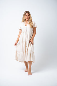  Love the Alice Dress, but want it longer?  Say hello to Dion Midi Dress! Featuring a linen blend, button up front, floaty cap sleeves and a three tier midi length skirt. Simple, chic and a great basic for your summer wardrobe. Available from www.arlowboutique.com