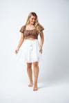 Sweet and soft, the Elliot skirt is a summer dream! Designed in an embroidered cotton, this skirt features an elastic waist for ease of fit and tie at the waist, a three tiered skirt and scalloped hemline. Great as a beach day throw on, brunch with the girls or a beautiful date night choice. Available from www.arlowboutique.com