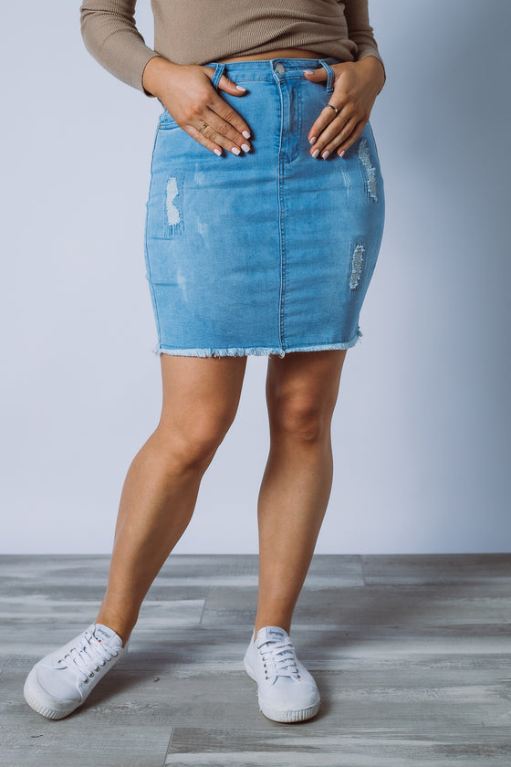 The Darcy Denim Skirt is available in light blue denim wash. Design features include a high waist fitted silhouette in stretch denim, five pocket styling, raw hemline, zip fly with button closure and tearing detail. Team with your favourite top and some sneakers for a comfy casual look. 