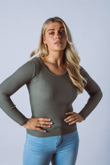  The Heritage Knit Top is the perfect basic, made from a fine rib knit fabric. Featuring a simple fitted shape, scoop neck and long sleeves. A fantastic transeasonal piece that you will be going back to year after year.  Available in 7 colours.