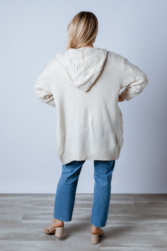 The Kailee knit is a cosy easy to wear Cardigan. Featuring an open front with patch pockets, hoodie and cable detailing. Wear back with a pair of your favourite skinny jeans, also available in rust colour. Arlow boutique.