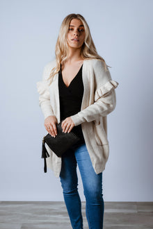  Soft and femme. The Essie Knit Cardigan features a gorgeous cream colour, a soft knit yarn with off shoulder frill detailing, front pockets and a mid thigh body length. Available from arlowboutique.com.au  