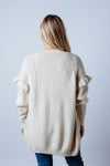 Soft and femme. The Essie Knit Cardigan features a gorgeous cream colour, a soft knit yarn with off shoulder frill detailing, front pockets and a mid thigh body length. Available from arlowboutique.com.au  